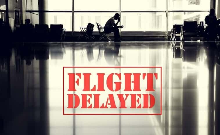 An image of a person waiting in the airport because of a flight delay